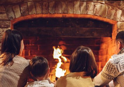Family by the night fire